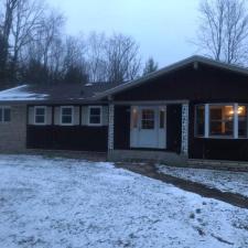 Mastic Carved Wood & Board and Batten Vinyl Siding, Soffit & Fascia, Seamless Gutters, AZEK PVC Post Cladding Trim, and Titan Clad Garage Door Installation in Steven's Point, WI 0