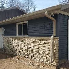 Mastic Carved Wood & Board and Batten Vinyl Siding, Soffit & Fascia, Seamless Gutters, AZEK PVC Post Cladding Trim, and Titan Clad Garage Door Installation in Steven's Point, WI 9