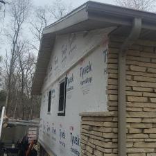 Mastic Carved Wood & Board and Batten Vinyl Siding, Soffit & Fascia, Seamless Gutters, AZEK PVC Post Cladding Trim, and Titan Clad Garage Door Installation in Steven's Point, WI 4