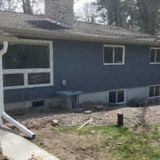 Mastic Carved Wood & Board and Batten Vinyl Siding, Soffit & Fascia, Seamless Gutters, AZEK PVC Post Cladding Trim, and Titan Clad Garage Door Installation in Steven's Point, WI 7