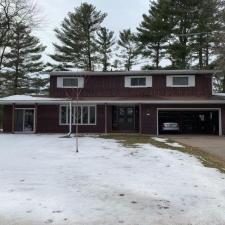 Mastic Carvedwood Vinyl Siding, Ledgestone Versetta Accent Stone, Garage Door Frame, Entry Door, Patio Door, Window, and Gutter Installation in Steven's Point, WI 0