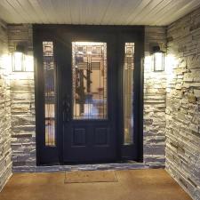 Mastic Carvedwood Vinyl Siding, Ledgestone Versetta Accent Stone, Garage Door Frame, Entry Door, Patio Door, Window, and Gutter Installation in Steven's Point, WI 9