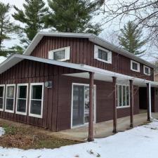 Mastic Carvedwood Vinyl Siding, Ledgestone Versetta Accent Stone, Garage Door Frame, Entry Door, Patio Door, Window, and Gutter Installation in Steven's Point, WI 3