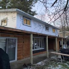 Mastic Carvedwood Vinyl Siding, Ledgestone Versetta Accent Stone, Garage Door Frame, Entry Door, Patio Door, Window, and Gutter Installation in Steven's Point, WI 4