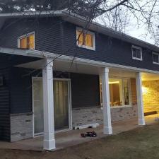 Mastic Carvedwood Vinyl Siding, Ledgestone Versetta Accent Stone, Garage Door Frame, Entry Door, Patio Door, Window, and Gutter Installation in Steven's Point, WI 5