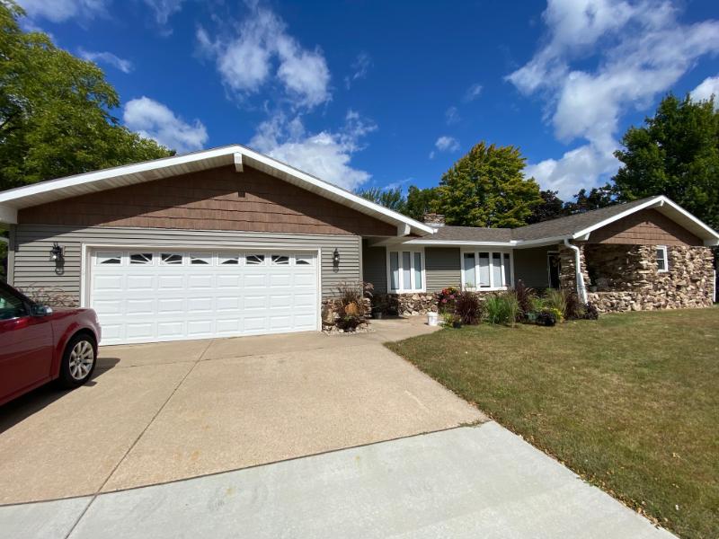 Vinyl Siding, Soffit, Seamless Gutters and Gutter Covers, and Titan Clad Garage in Stevens Point, WI